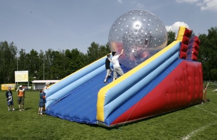 Pushing Zorbing Ball Down An Inflatable Slide