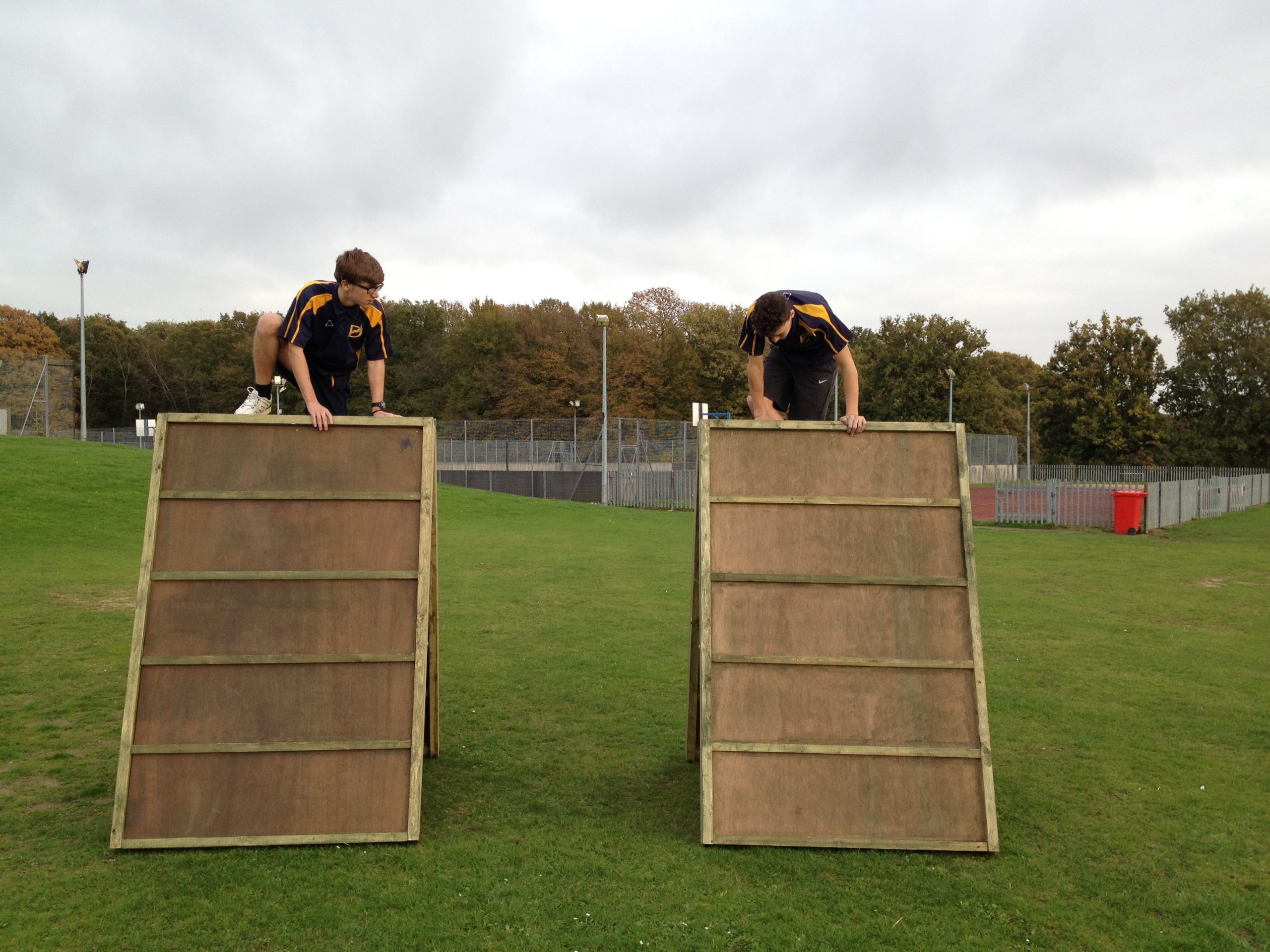Children On Obstacle Course Equipment