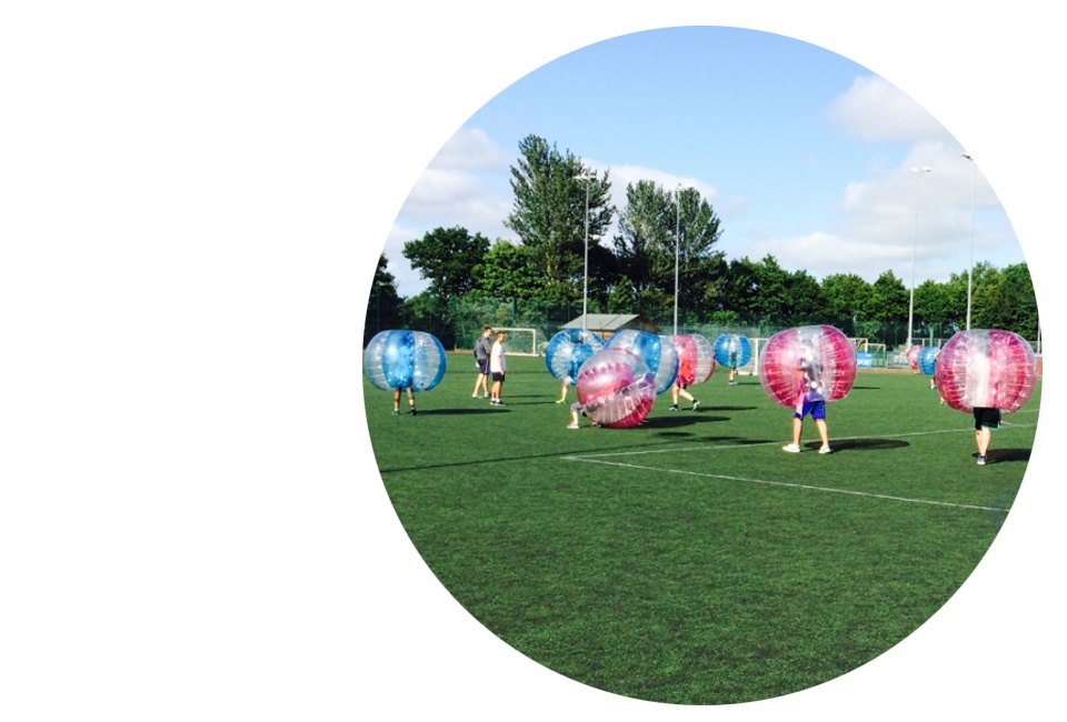 People Playing Bubble Football